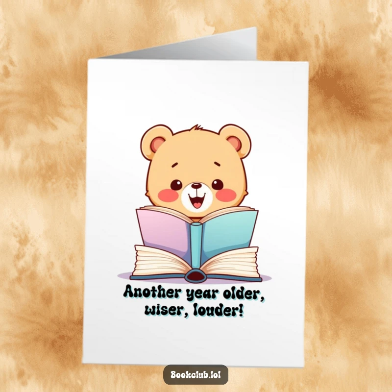 Funny Free Printable Birthday Card featuring an excited bear cub devouring a giant book, ready to celebrate.
